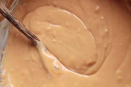 bread with custard delicious on wood backgroundの写真素材