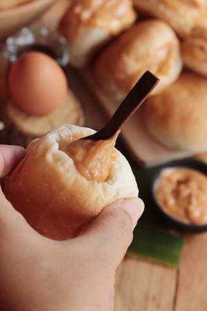 bread with custard delicious on wood backgroundの写真素材