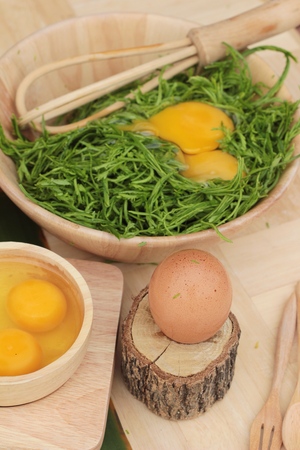 Egg and vegetables acacia pennata for omelet cookingの写真素材