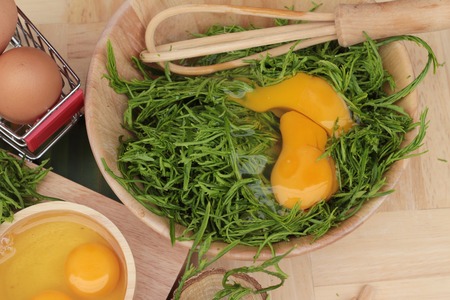 Egg and vegetables acacia pennata for omelet cookingの写真素材