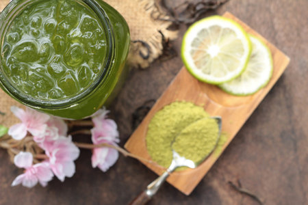 Iced green tea with lemon and matcha tea powderの写真素材
