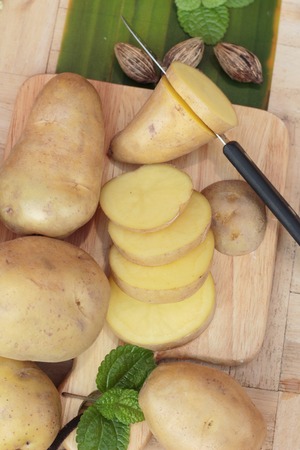 Potatoes raw vegetables with slices for cookingの写真素材