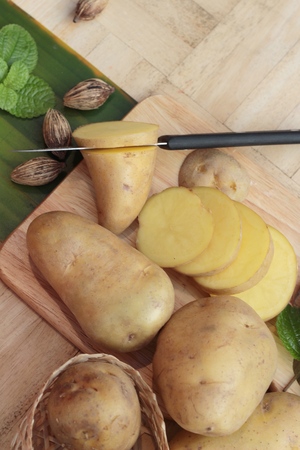 Potatoes raw vegetables with slices for cookingの写真素材