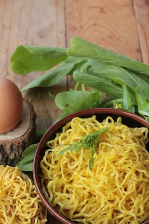 Egg noodles and raw noodles for cookingの写真素材