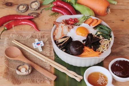 Bibimbap korean food is delicious on wood backgroundの写真素材