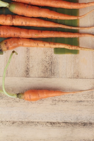 fresh carrot vegetables organic on wood backgroundの写真素材