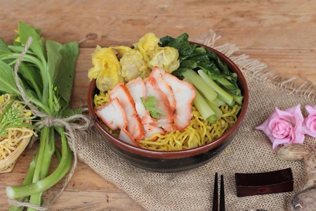 Egg noodles with pork and dumpling is deliciousの写真素材