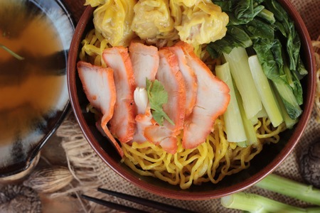 Egg noodles with pork and dumpling is deliciousの写真素材