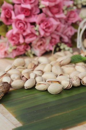 Pistachio nuts is tasty on wood background