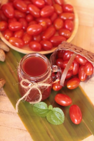 Tomato juice and pear cherry tomatoesの写真素材