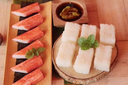 Crab stick with wasabi sauce and making sushiの写真素材