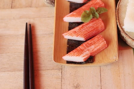 Crab stick with wasabi sauce and making sushiの写真素材