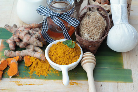 Turmeric powder with honey and milk for scrub