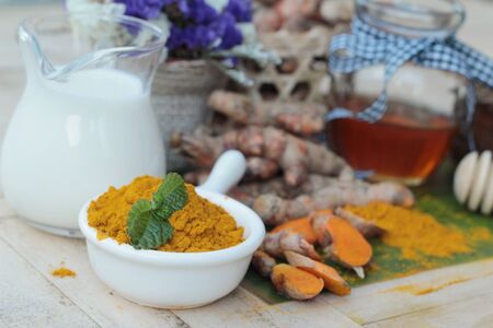 Turmeric powder with honey and milk for scrubの写真素材