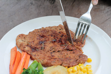 Grilled pork steak with  bread and ketchupの写真素材