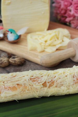 Baked bread sprinkle mozarella cheese is deliciousの写真素材