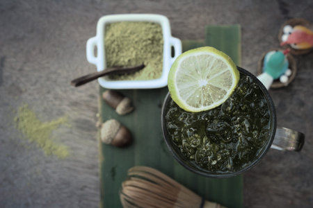 Iced green tea with lemon and matcha tea powder