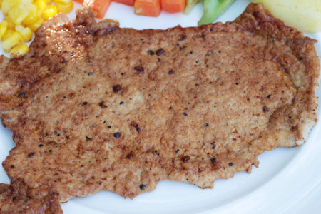Pork steak with vegetables and tomato sauce