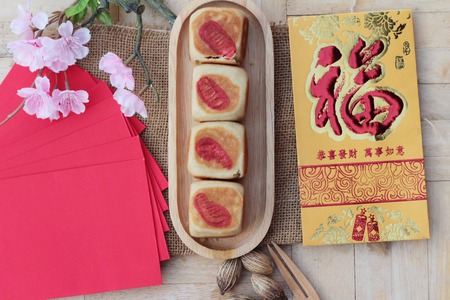 Festival moon cake with red envelopes, Chinese New Yearの写真素材