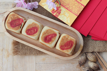 Festival moon cake with red envelopes, Chinese New Yearの写真素材