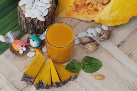 Fresh pumpkin smoothie in glass is deliciousの写真素材