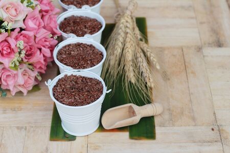 Flax seeds for health on wood backgroundの写真素材