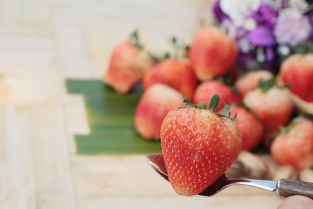 fresh strawberries is delicious on wood backgroundの写真素材