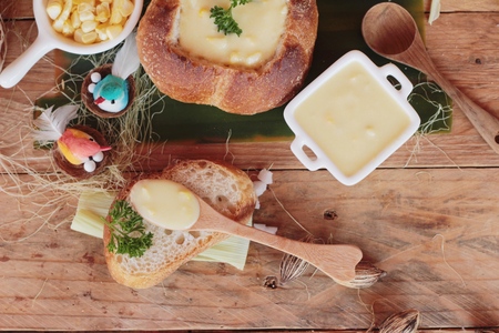 Corn soup in bread bowl with fresh cornの写真素材