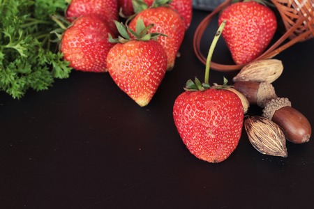 Fresh strawberries is delicious on black backgroundの写真素材