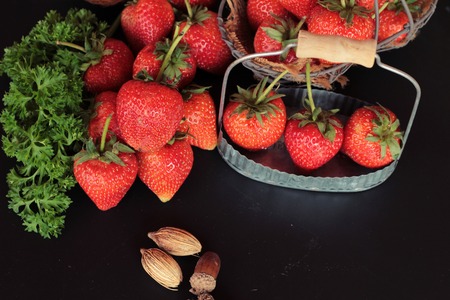 Fresh strawberries is delicious on black backgroundの写真素材