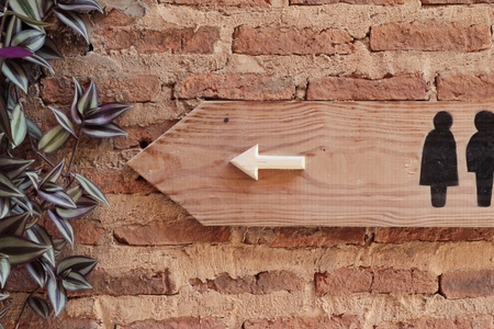 Symbolize arrow pointing go to way toiletの写真素材