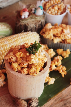 Popcorn with butter and fresh corn cobの写真素材