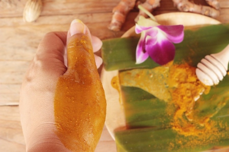 Turmeric powder with honey ,milk, salt for scrubの写真素材