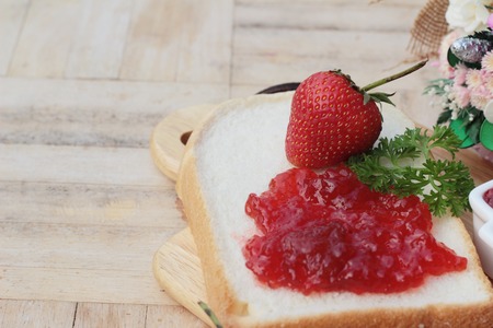 Strawberry jam with slice of bread deliciousの写真素材