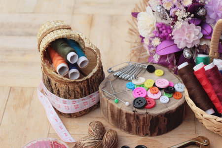 Sewing accessories for sewing on wood background