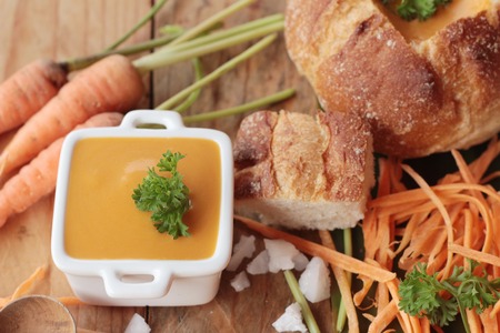 Carrot cream soup with bread is deliciousの写真素材