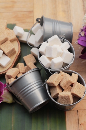 Cane sugar cubes and white sugar cubesの写真素材