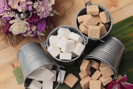 Cane sugar cubes and white sugar cubesの写真素材