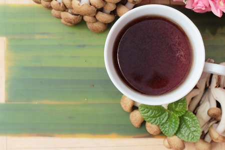 Mushroom tea for health and fresh mushroomsの写真素材