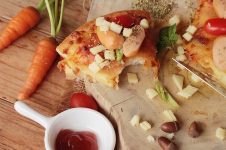 Italian pizza is delicious on wood backgroundの写真素材