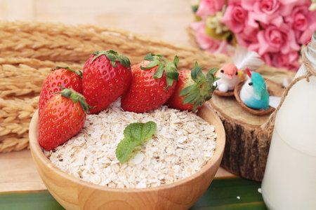 Oatmeal with milk and fresh strawberry for healthの写真素材
