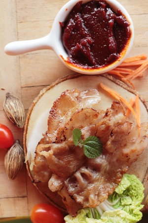 Pork bacon grilled on pan and fresh porkの写真素材