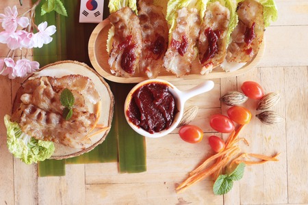 Pork bacon grilled on pan and fresh porkの写真素材