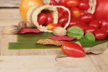 Fresh red tomatoes organic on wood backgroundの写真素材