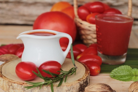 Tomato juice with fresh tomatoes is tastyの写真素材