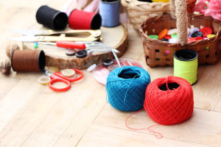 Sewing accessories for sewing on wood background