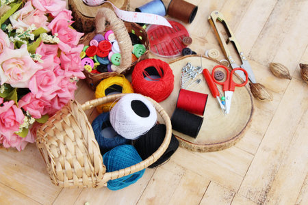 Sewing accessories for sewing on wood background