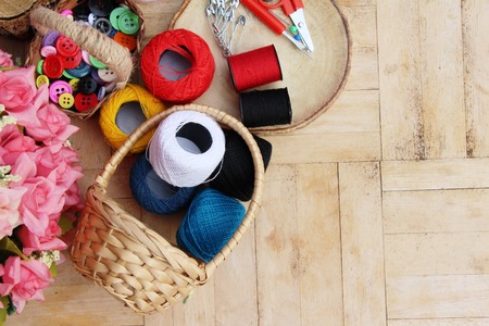 Sewing accessories for sewing on wood backgroundの写真素材
