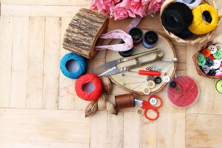 Sewing accessories for sewing on wood backgroundの写真素材