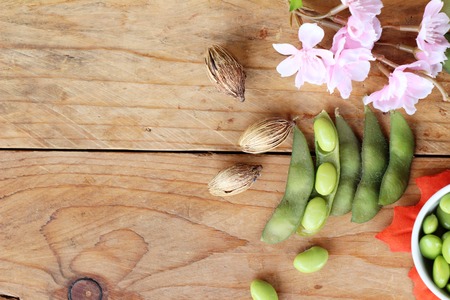 Green japanese soybean delicious on wood backgroundの写真素材